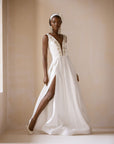 An Ivory White Satin Ball Dress With Swarovski embellished V-Neckline